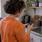 Freelancer making a quick phone check-in