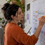 Freelancer reviewing a marked weekly calendar